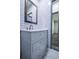 Bathroom with subway tile, white vanity, and marble-look floor at 995 Highway 101 S, Temple, GA 30179