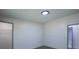 Bright bedroom with neutral walls, carpet, and doorways to closet and bathroom at 995 Highway 101 S, Temple, GA 30179