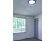 Bedroom with a window featuring blinds and neutral-colored walls at 995 Highway 101 S, Temple, GA 30179