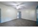 This bedroom boasts two large windows, and has neutral walls and carpet at 995 Highway 101 S, Temple, GA 30179