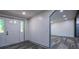 Welcoming entryway with a decorative glass front door and gray wood-look flooring at 995 Highway 101 S, Temple, GA 30179