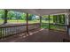 Spacious covered front porch offers a relaxing view of the surrounding neighborhood at 995 Highway 101 S, Temple, GA 30179