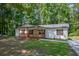 Charming single story home featuring a large yard and lovely covered front porch perfect for relaxing at 995 Highway 101 S, Temple, GA 30179