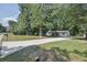 Charming single story home featuring a large yard and lovely covered front porch perfect for relaxing at 995 Highway 101 S, Temple, GA 30179