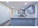 Well-lit kitchen featuring gray cabinets, granite counters, stainless appliances, and an island at 995 Highway 101 S, Temple, GA 30179