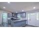 Modern gray kitchen with granite countertops, stainless steel appliances, and eat-in bar at 995 Highway 101 S, Temple, GA 30179