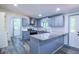Updated kitchen boasts gray cabinets, a stainless steel range hood, and outdoor access at 995 Highway 101 S, Temple, GA 30179
