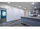 Kitchen with stainless steel appliances, gray cabinets, granite counters, and eat-in bar at 995 Highway 101 S, Temple, GA 30179