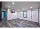 Light-filled living room with stylish floors and a decorative front door at 995 Highway 101 S, Temple, GA 30179