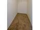 Walk-in closet features neutral walls and carpet with wire shelving at 995 Highway 101 S, Temple, GA 30179