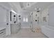 Modern bathroom with a glass shower, soaking tub, and stylish fixtures at 4256 Weaver Se St, Smyrna, GA 30080
