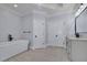 Stylish bathroom featuring a soaking tub, double doors and dual vanity at 4256 Weaver Se St, Smyrna, GA 30080