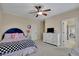 Charming bedroom with ceiling fan, TV, and an adjacent sitting area for guests or Gathering at 4256 Weaver Se St, Smyrna, GA 30080