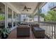 Relaxing covered porch with comfortable seating and a ceiling fan, perfect for outdoor enjoyment at 4256 Weaver Se St, Smyrna, GA 30080