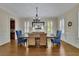 Formal dining room with a hardwood floor, stylish furniture, and bright, natural light at 4256 Weaver Se St, Smyrna, GA 30080