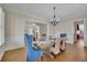Dining room with hardwood floors, modern chandelier, and neutral decor at 4256 Weaver Se St, Smyrna, GA 30080