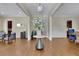 Bright foyer featuring hardwood floors and an elegant table with white flowers at 4256 Weaver Se St, Smyrna, GA 30080