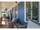 Comfortable front porch with wicker furniture, offering a relaxing outdoor living space at 4256 Weaver Se St, Smyrna, GA 30080