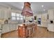 Beautiful kitchen with custom cabinets, granite countertops, a gas cooktop, and a double oven at 4256 Weaver Se St, Smyrna, GA 30080