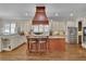 Spacious kitchen featuring custom cabinets, granite countertops, and a central island with seating at 4256 Weaver Se St, Smyrna, GA 30080