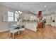 Open-concept kitchen with stainless steel appliances and a breakfast nook with hardwood flooring at 4256 Weaver Se St, Smyrna, GA 30080
