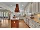 Open kitchen design with granite countertops, stainless steel appliances, a large island, and hardwood floors at 4256 Weaver Se St, Smyrna, GA 30080
