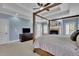 Spacious main bedroom with fireplace, ceiling fan, and lots of natural light at 4256 Weaver Se St, Smyrna, GA 30080
