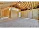 Unfinished room with exposed beams, wood walls and ceiling at 4256 Weaver Se St, Smyrna, GA 30080
