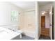 Bright bathroom with a gray vanity, white countertop, and a shower-tub combo at 737 Polk Nw St, Marietta, GA 30064