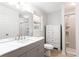 Modern bathroom with a gray vanity, white countertop, and a glass-enclosed shower at 737 Polk Nw St, Marietta, GA 30064