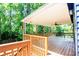 Spacious outdoor deck featuring a ceiling fan and wooden railings, perfect for relaxing and entertaining at 737 Polk Nw St, Marietta, GA 30064