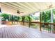 Spacious deck with wood railing, ceiling fan, and serene backyard views at 737 Polk Nw St, Marietta, GA 30064