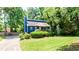 Charming blue two-story home with well-manicured lawn and mature trees at 737 Polk Nw St, Marietta, GA 30064
