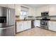 Well-equipped kitchen featuring white cabinetry and stainless steel appliances at 737 Polk Nw St, Marietta, GA 30064