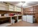 Laundry room with washer, dryer, shelving, and counter space for folding at 737 Polk Nw St, Marietta, GA 30064