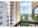 Balcony view of the city with buildings and trees visible at 795 Hammond Dr # 1012, Atlanta, GA 30328
