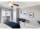 Bedroom with a ceiling fan, a desk, and balcony access at 795 Hammond Dr # 1012, Atlanta, GA 30328