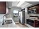Kitchen with stainless steel appliances, granite countertops, and a view of the city at 795 Hammond Dr # 1012, Atlanta, GA 30328