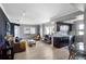 Spacious living room and kitchen with wood floors, modern lighting, and open floor plan at 795 Hammond Dr # 1012, Atlanta, GA 30328