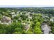 Aerial view of neighborhood, park, and swimming pool, surrounded by lush trees at 1622 Gates Nw Pl, Atlanta, GA 30318