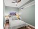Relaxing bedroom with hardwood floors, cozy bed, and modern decor art providing a comfortable space at 1622 Gates Nw Pl, Atlanta, GA 30318