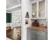 View of a dining area with hardwood floors, wine rack and display cabinets at 1622 Gates Nw Pl, Atlanta, GA 30318