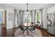 Cozy dining area features hardwood floors, modern lighting and stainless steel refrigerator at 1622 Gates Nw Pl, Atlanta, GA 30318