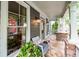 Inviting front porch with stylish decor, comfortable seating, and a view of the charming neighborhood at 1622 Gates Nw Pl, Atlanta, GA 30318