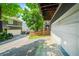 Attached garage with wide driveway and trees, offering ample parking and curb appeal at 1622 Gates Nw Pl, Atlanta, GA 30318
