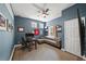 Comfortable home office featuring a desk, chair, sofa, and natural light from the window at 1622 Gates Nw Pl, Atlanta, GA 30318