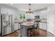Kitchen with granite countertops, stainless steel appliances, island and hardwood floors at 1622 Gates Nw Pl, Atlanta, GA 30318