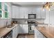 Kitchen features granite countertops, stainless steel appliances, and hardwood floors at 1622 Gates Nw Pl, Atlanta, GA 30318