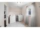 Bright laundry room with white washer, dryer, and natural light from the window at 1622 Gates Nw Pl, Atlanta, GA 30318