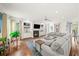 Bright and inviting living room with a fireplace, built-in shelving, and ample natural light at 1622 Gates Nw Pl, Atlanta, GA 30318